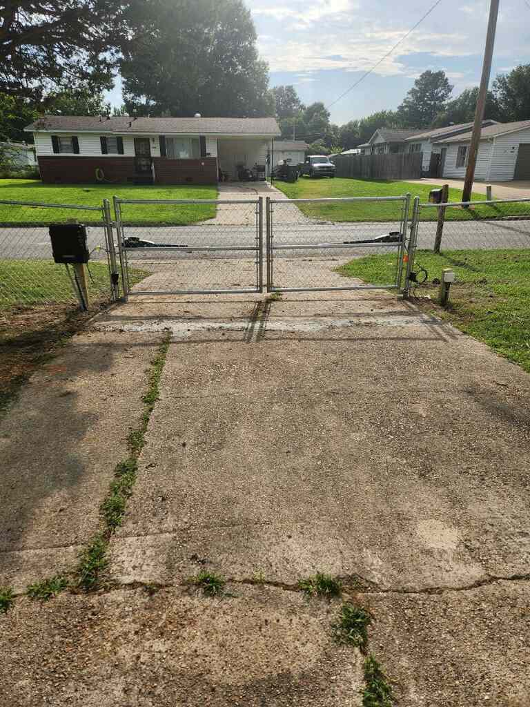 Chain link driveway gate and fence