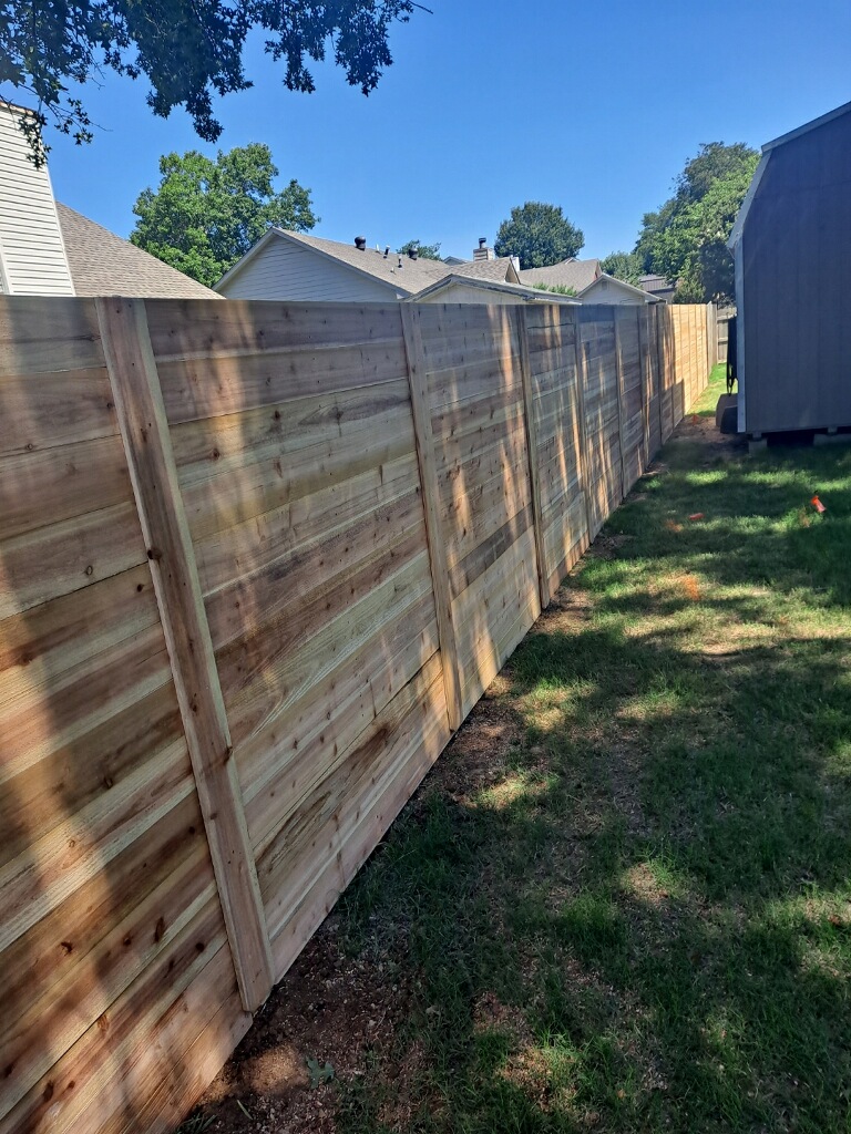 Wood fence running along a residential side yard