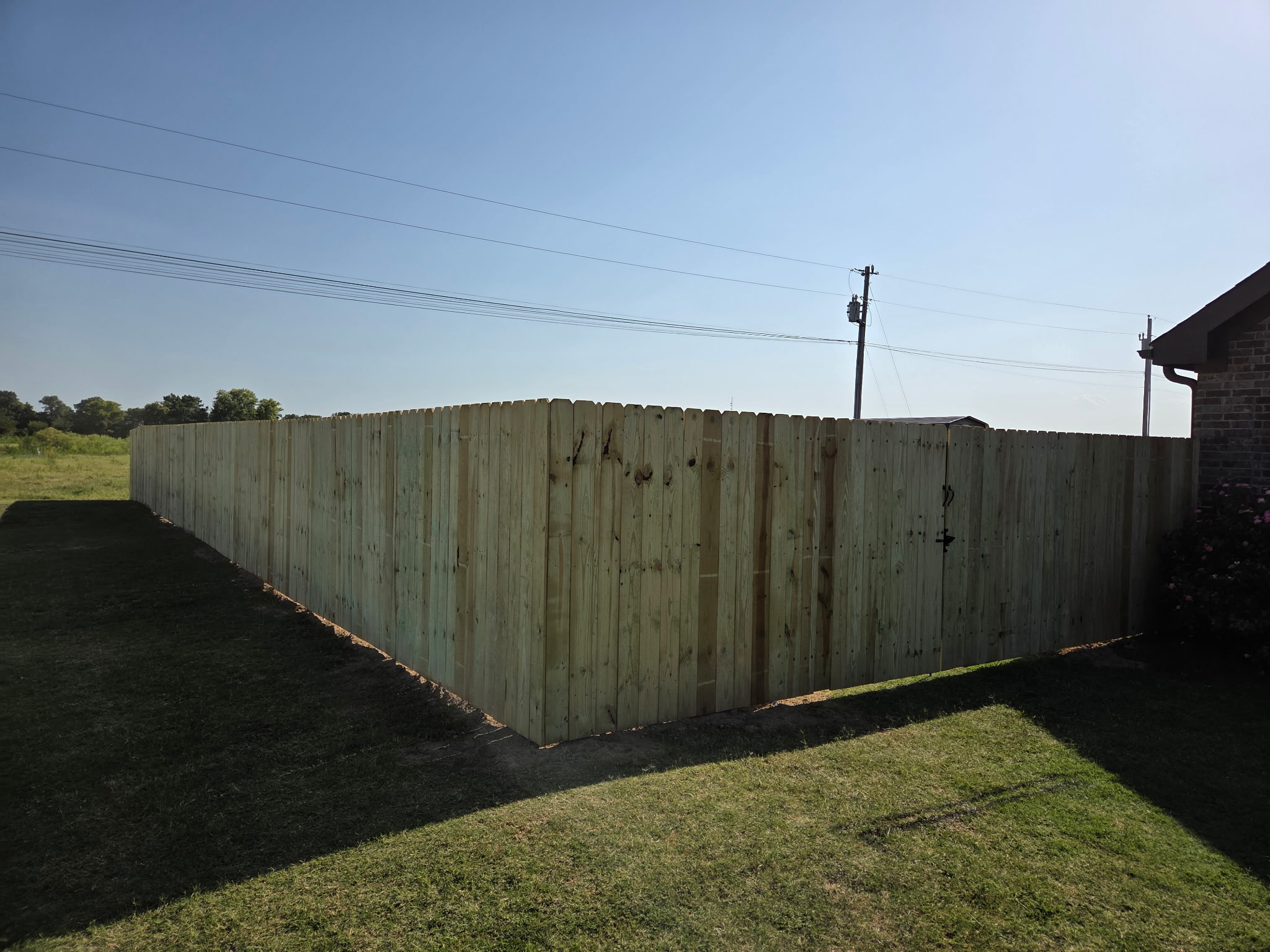 Wood privacy fence following a property corner